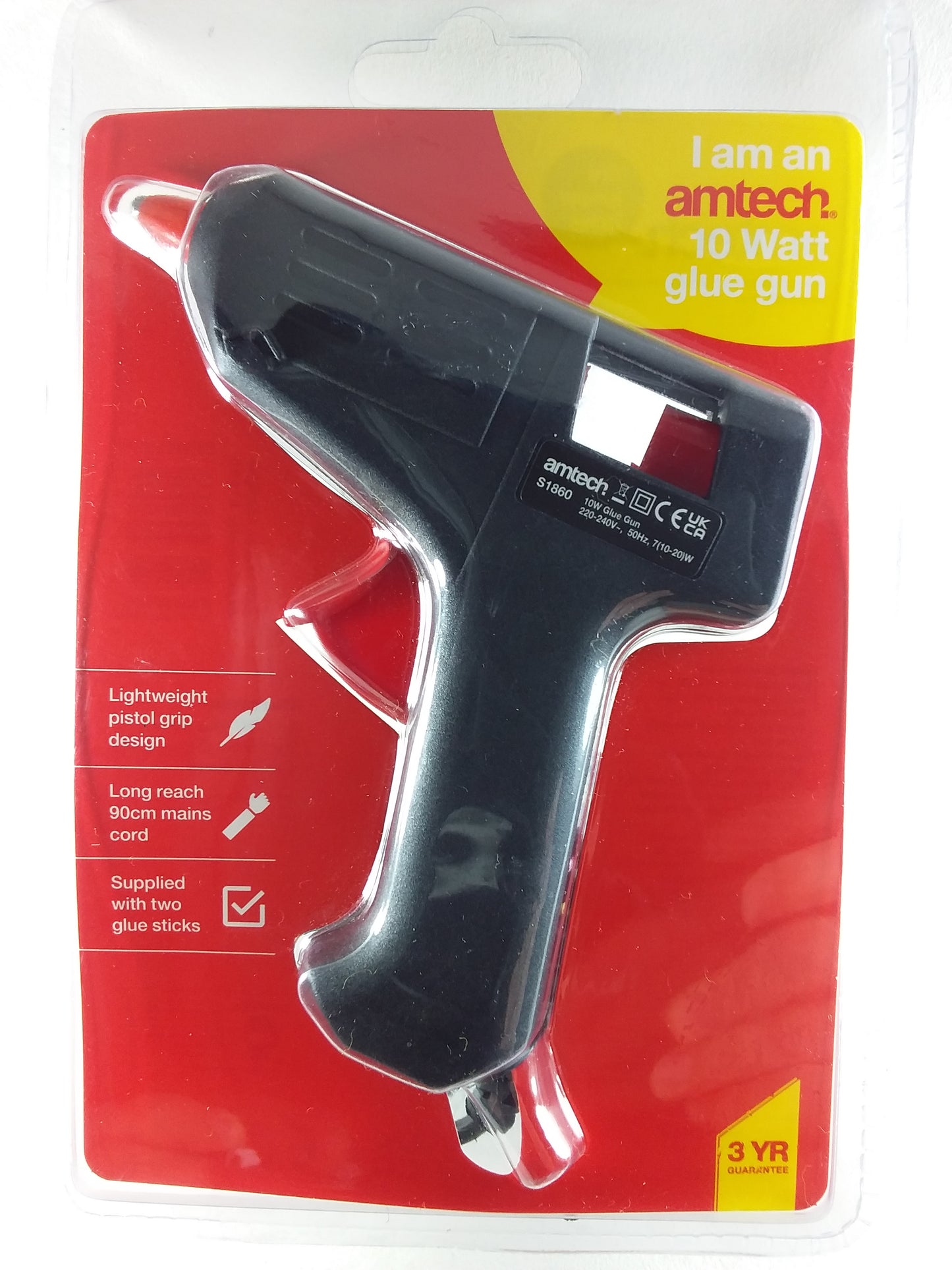 A black 10W hot glue gun by Amtech, packaged in a red and yellow blister pack, includes two glue sticks.