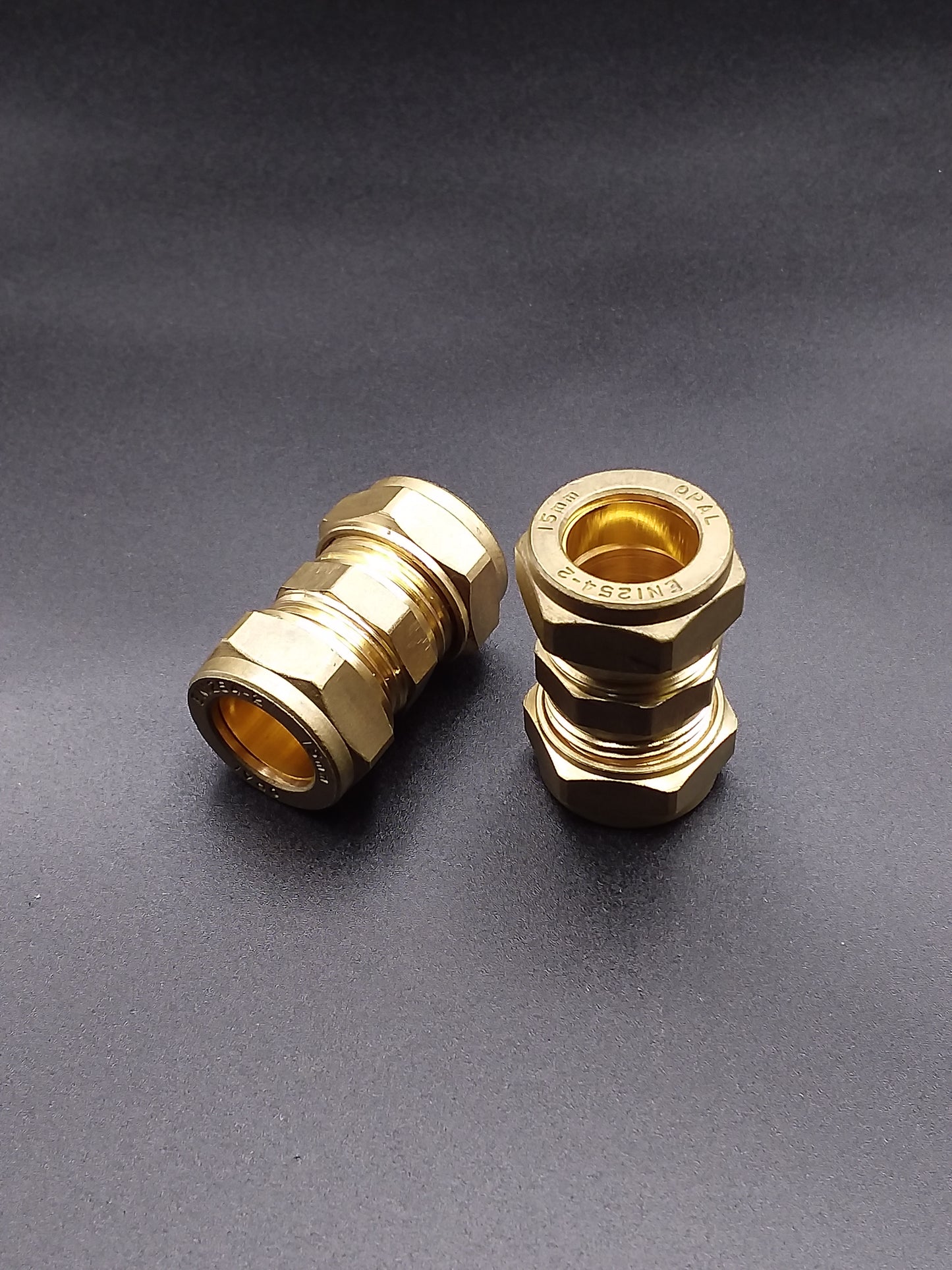 Brass compression pipe connectors.
