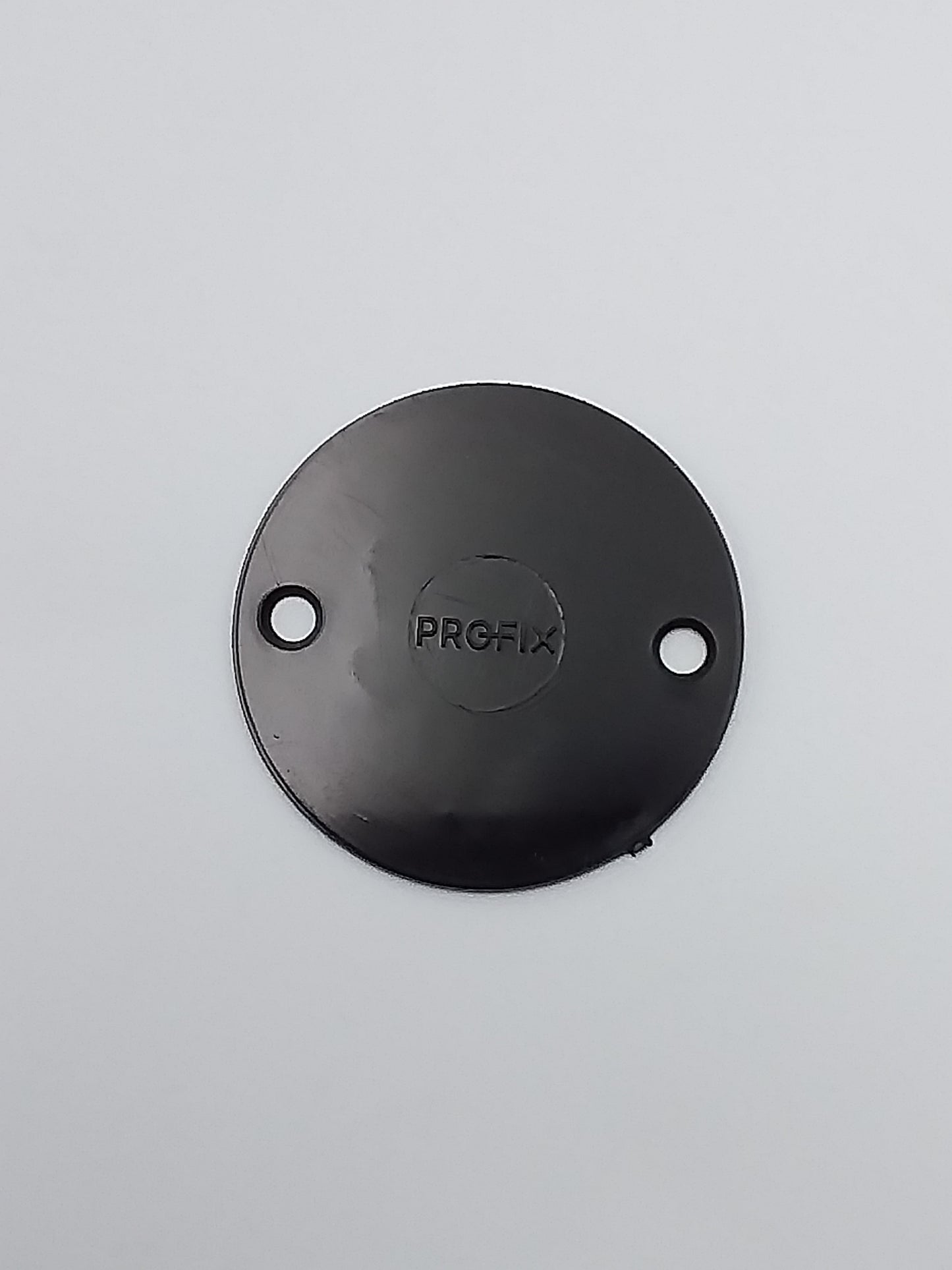 A black metal conduit box lid with the brand name 'PROFI' embossed on it.