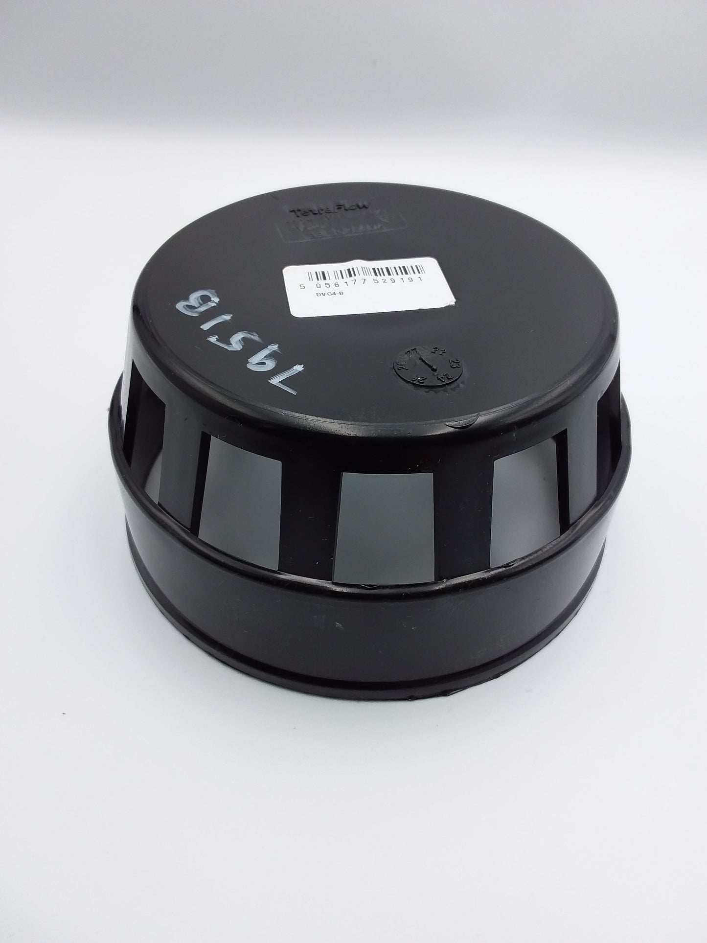 A black plastic bird cage with a label on top that reads '110 mm