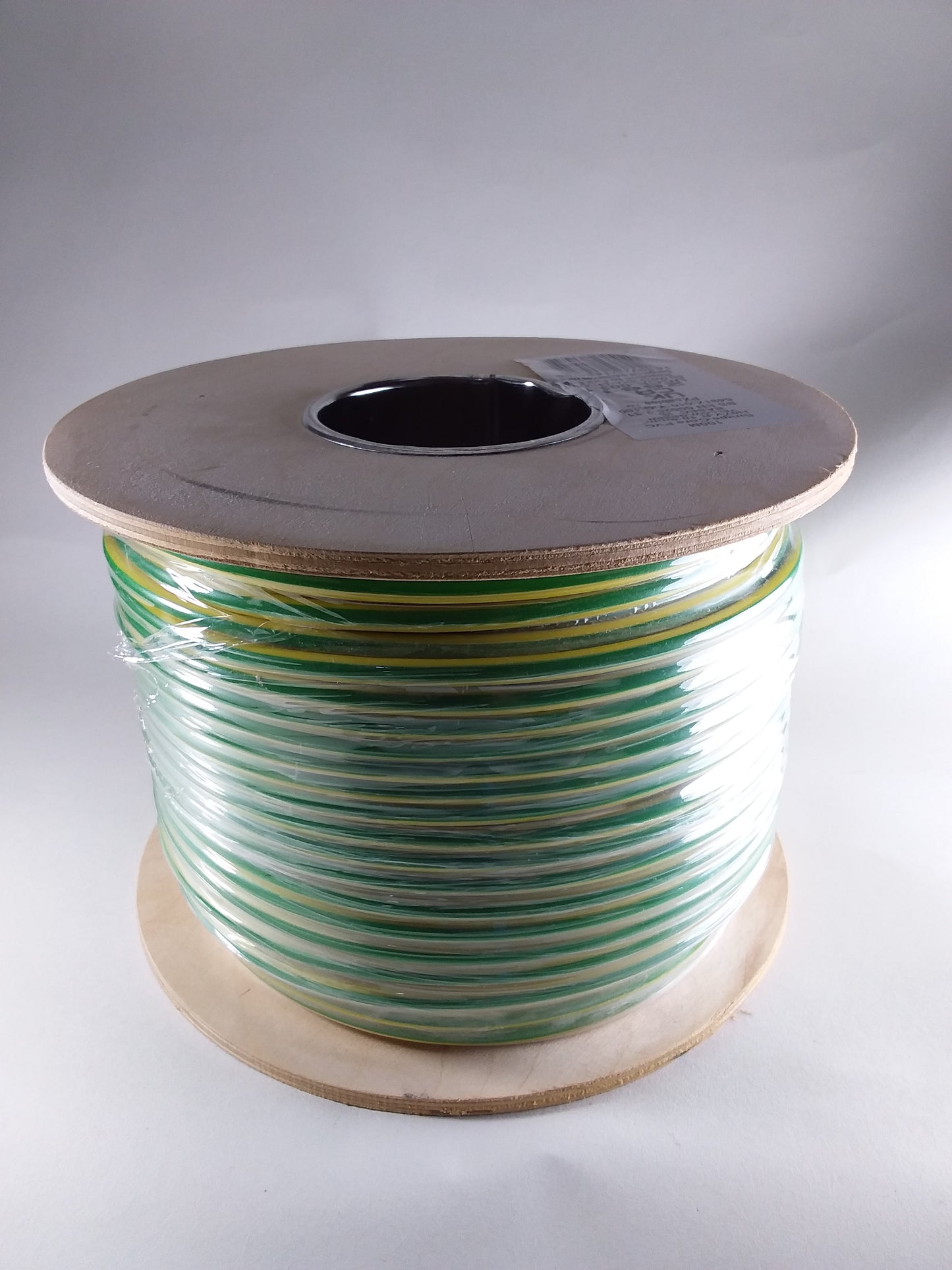Green and yellow colored electrical wire or cable.