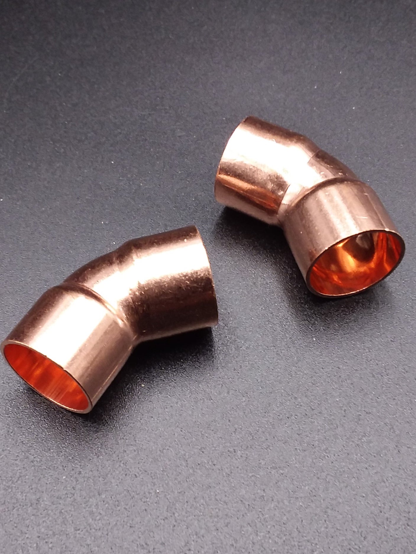 22mm end feed 45deg bend, typically used in plumbing.
