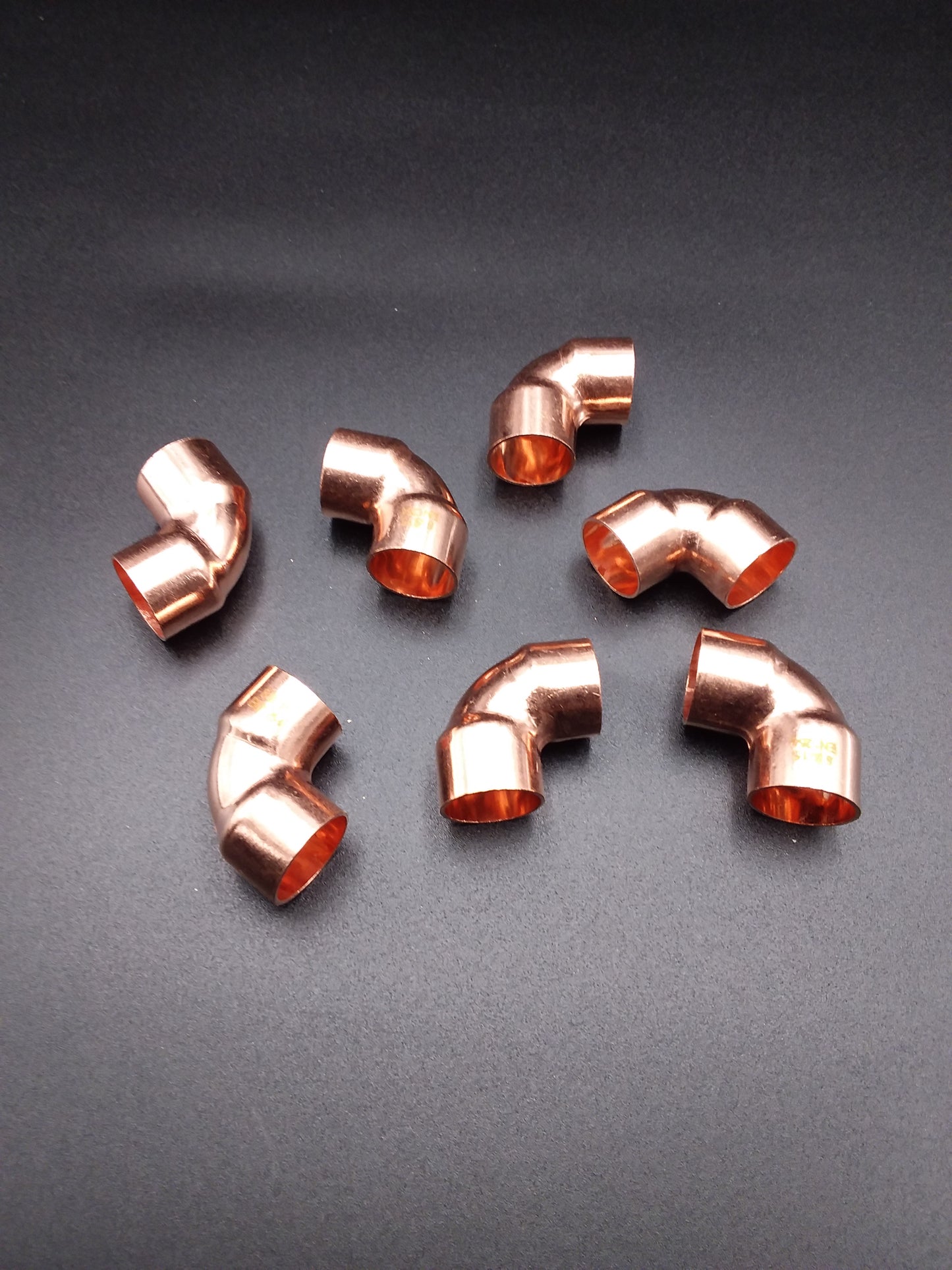Copper 15mm end feed 90deg elbows for plumbing.