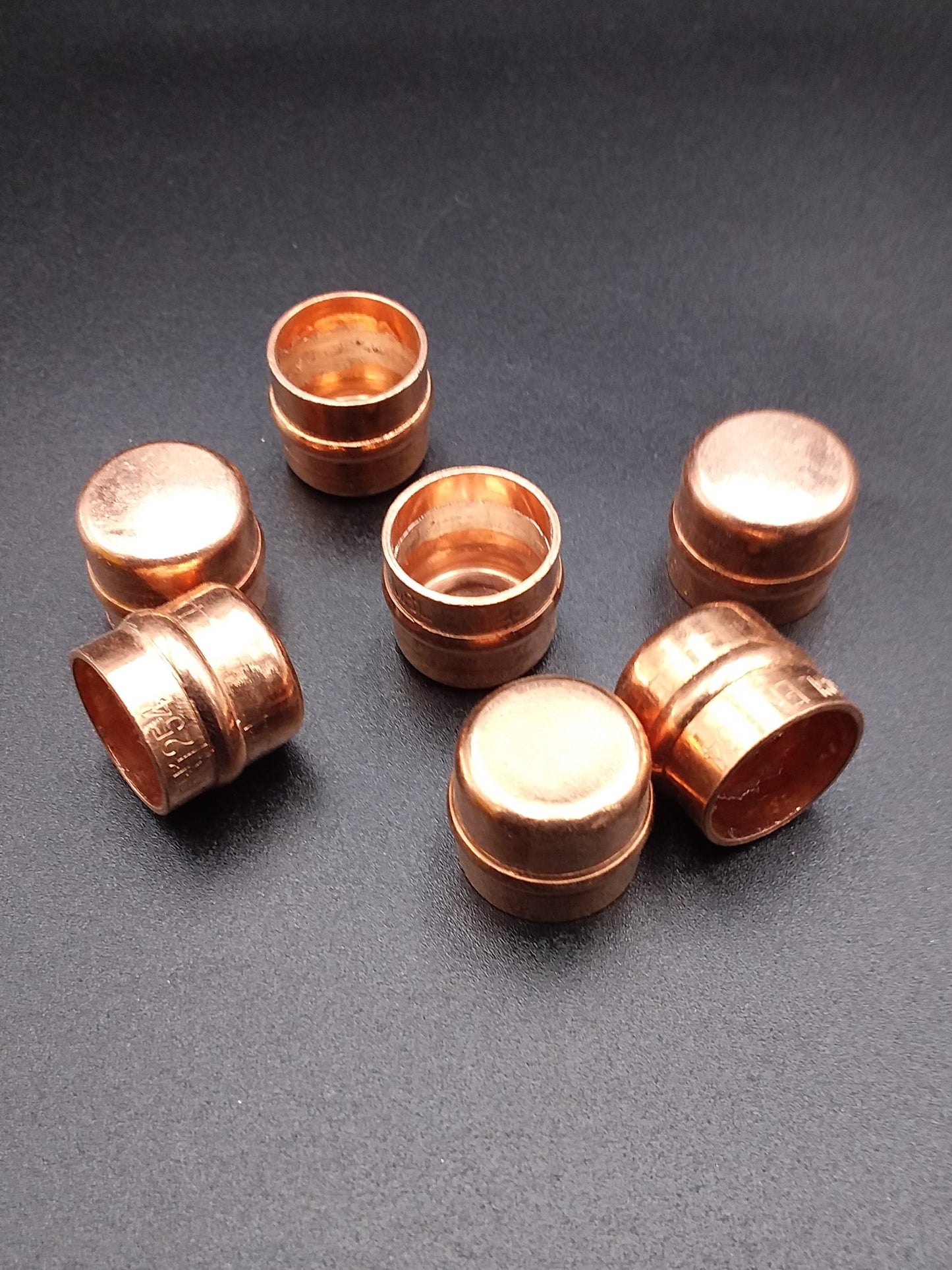 Copper solder ring end caps.