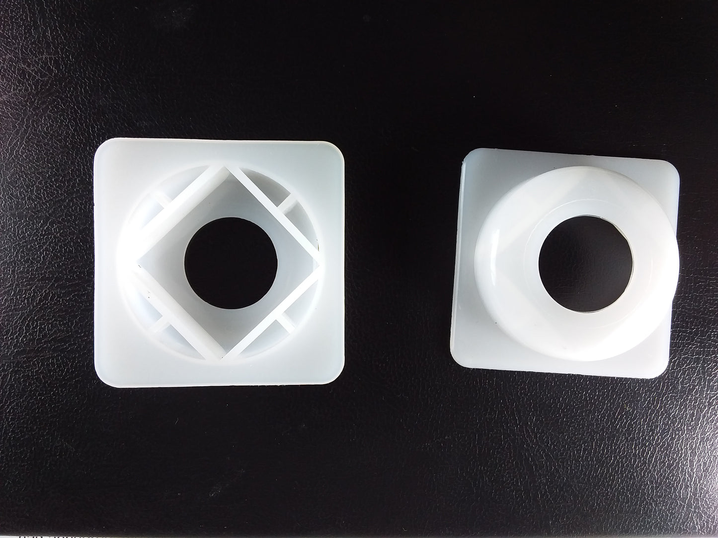 1/2" square top hat spacer washers with a central circular hole.