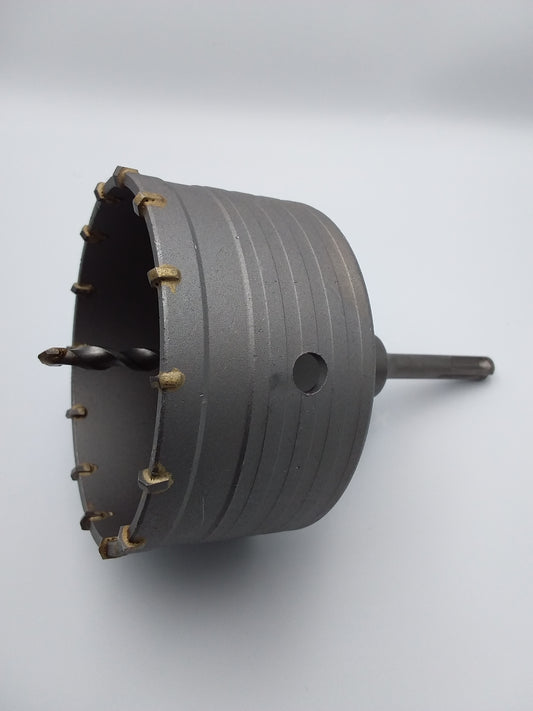 110mm TCT core drill with a 10mm SDS shank and fluted drill bits, designed for penetrating hard rock formations.