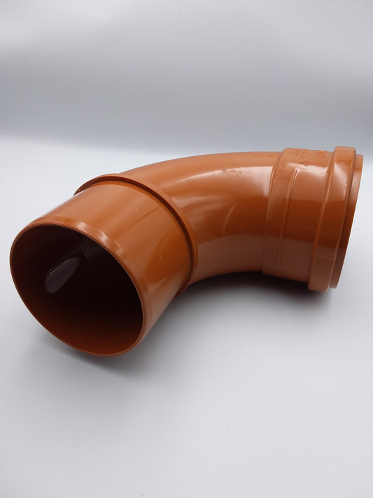110mm 90-degree bend orange colored underground pipe connector made of plastic.