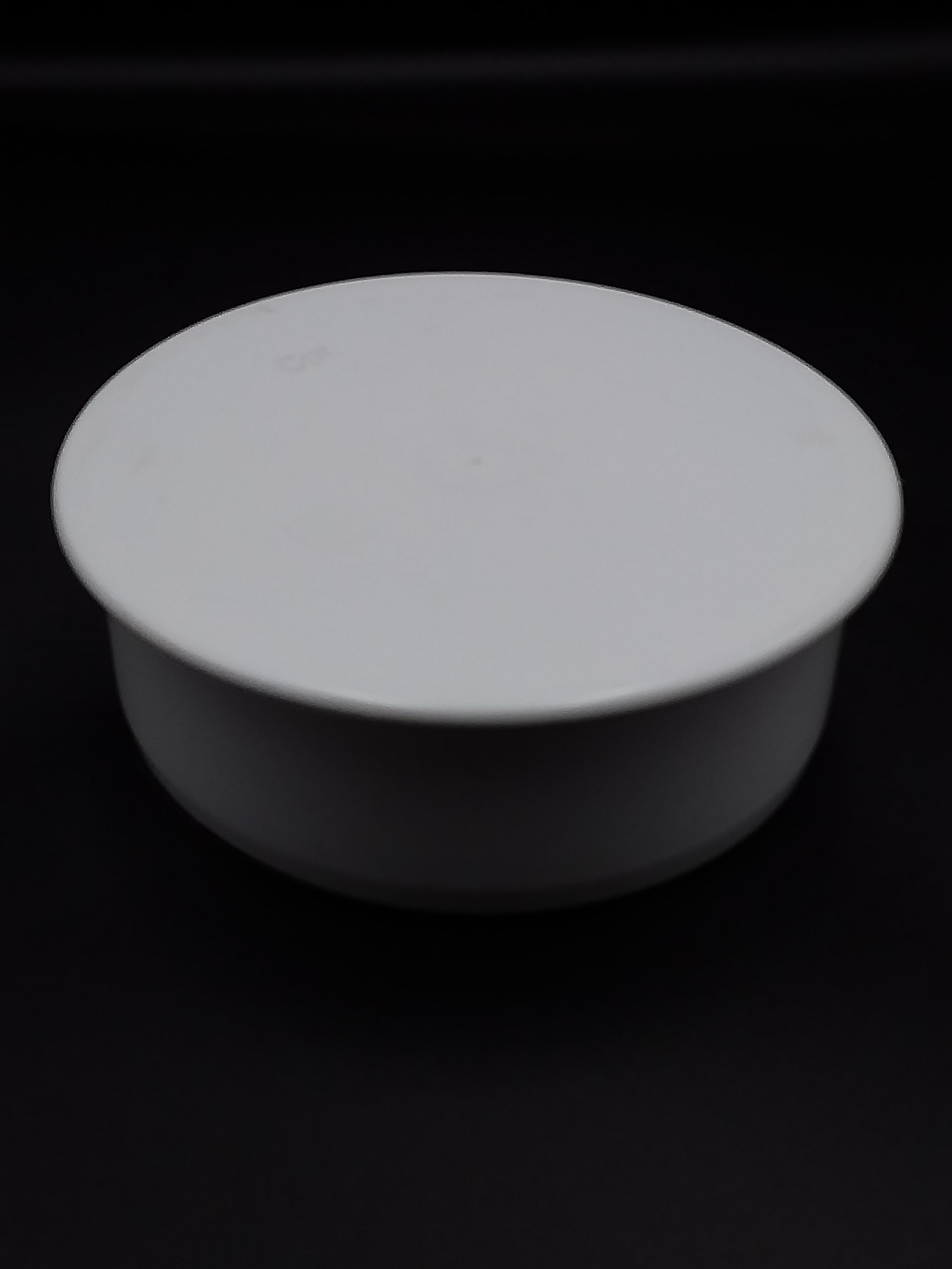 110mm white push fit socket plug, also known as an end cap.