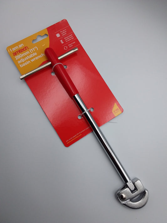 An 11 inch adjustable basin wrench with a red handle and silver metal parts, packaged on a cardboard backing with a yellow and red product label.