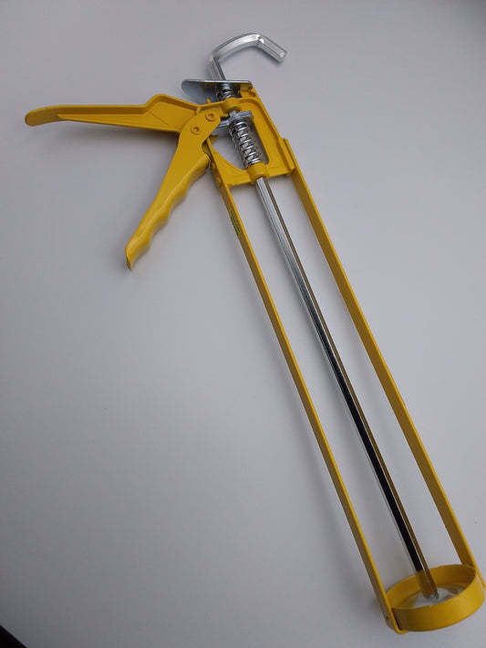 11" yellow caulking gun with a metal barrel and a handle.