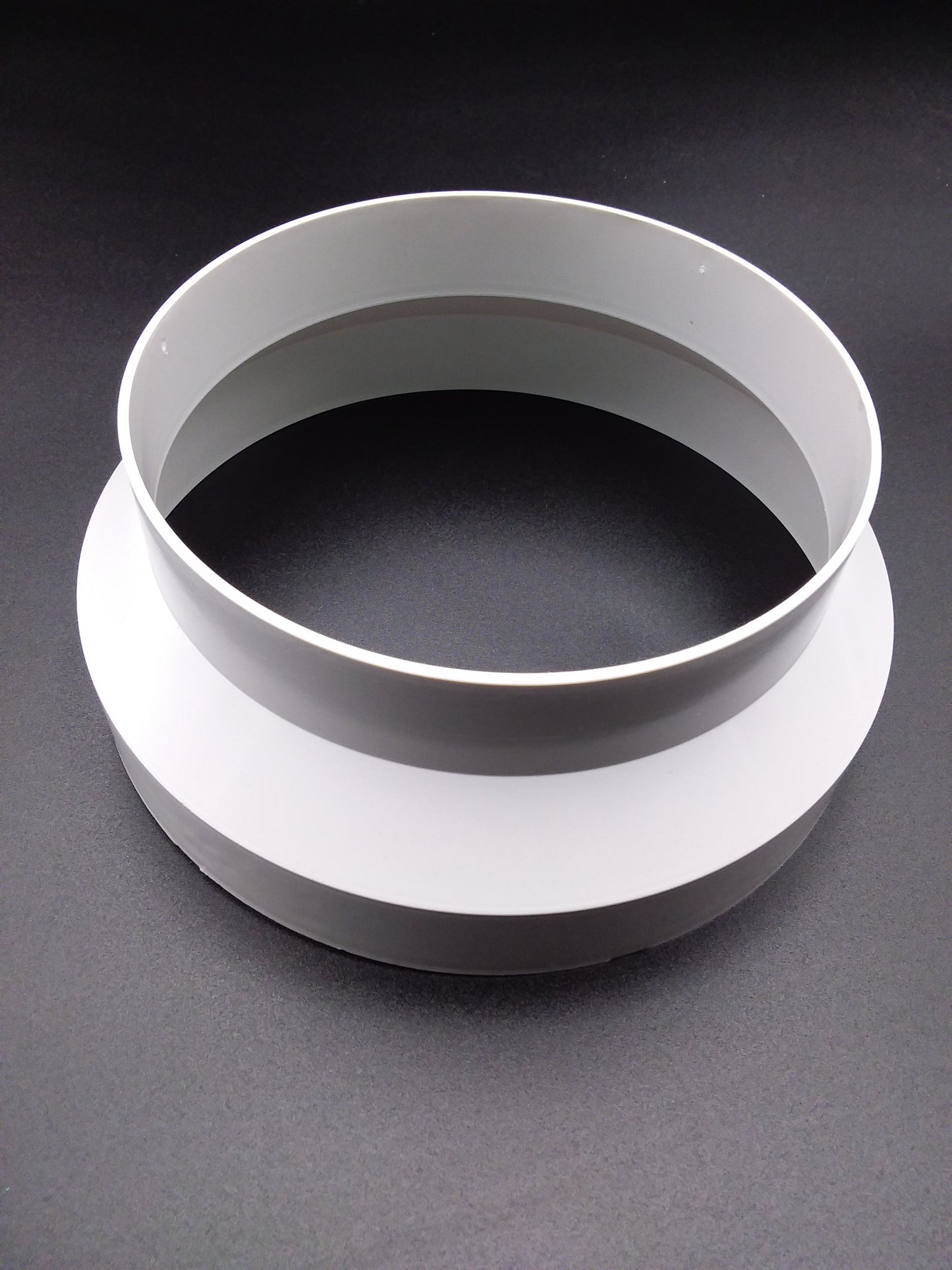 A white ducting reducer designed for connecting air ducts with a 150 x 125mm size.
