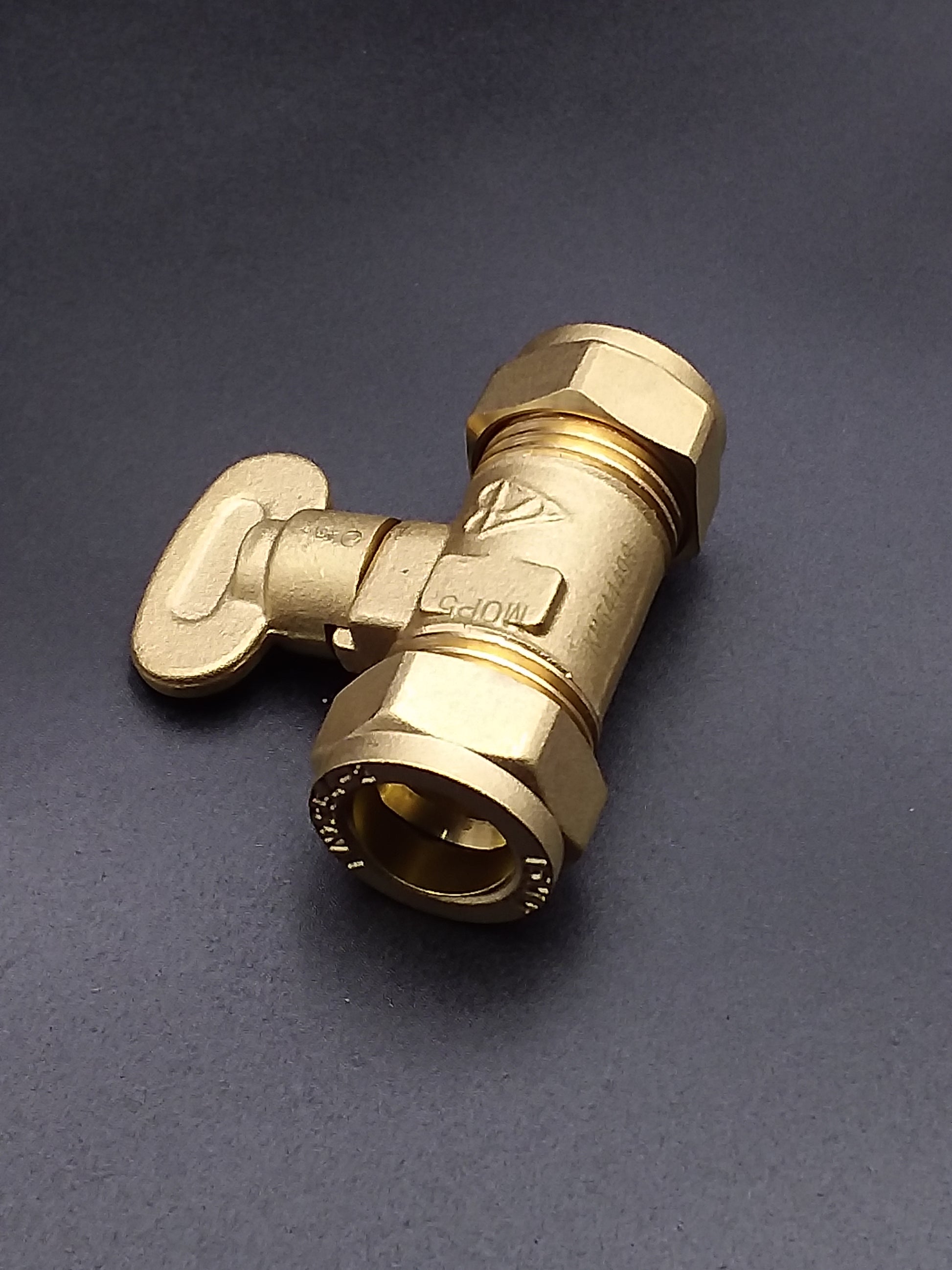 Brass gas isolating valve with a key operating mechanism.