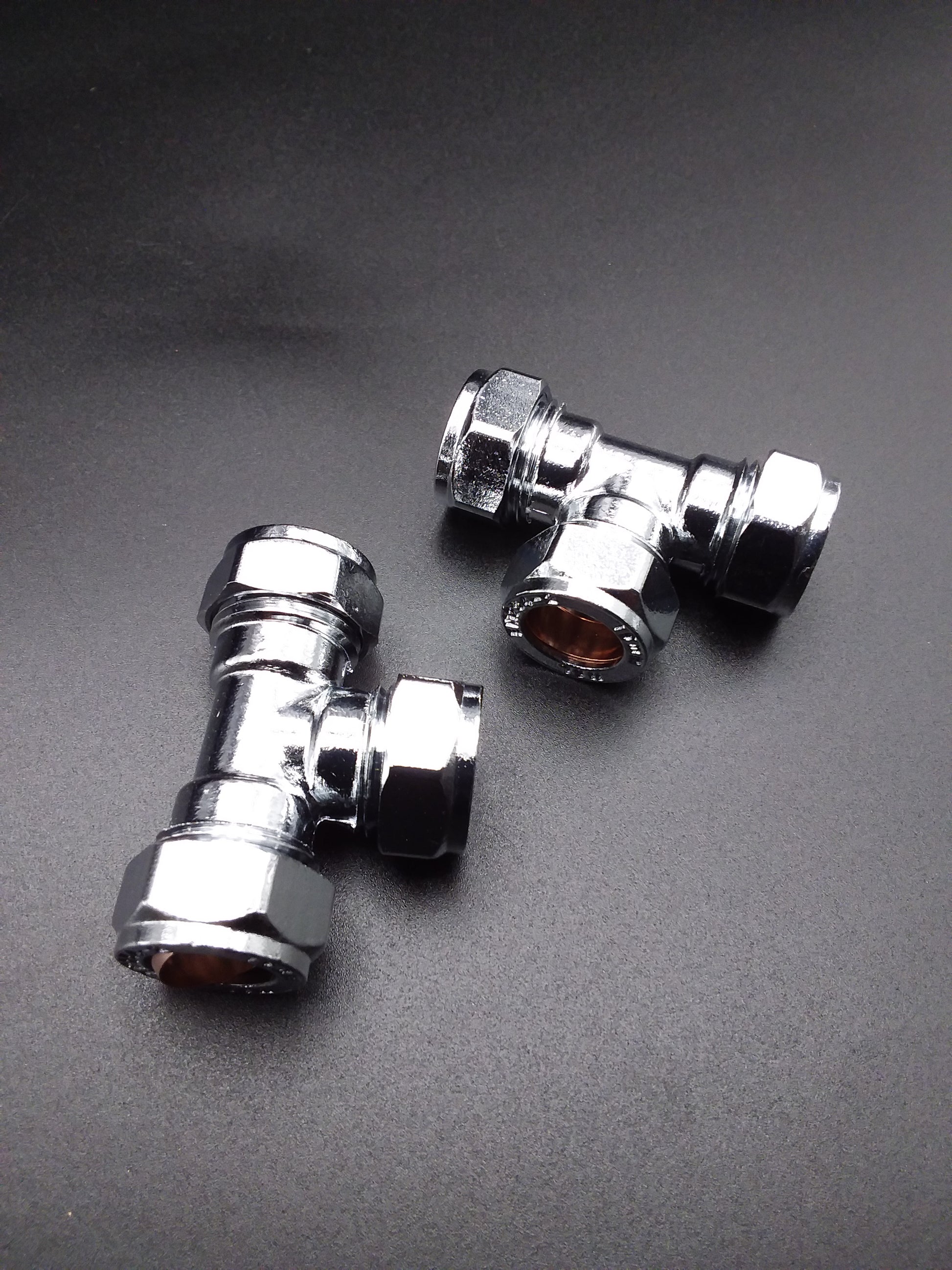15mm chrome-plated compression tee typically used as plumbing fittings.