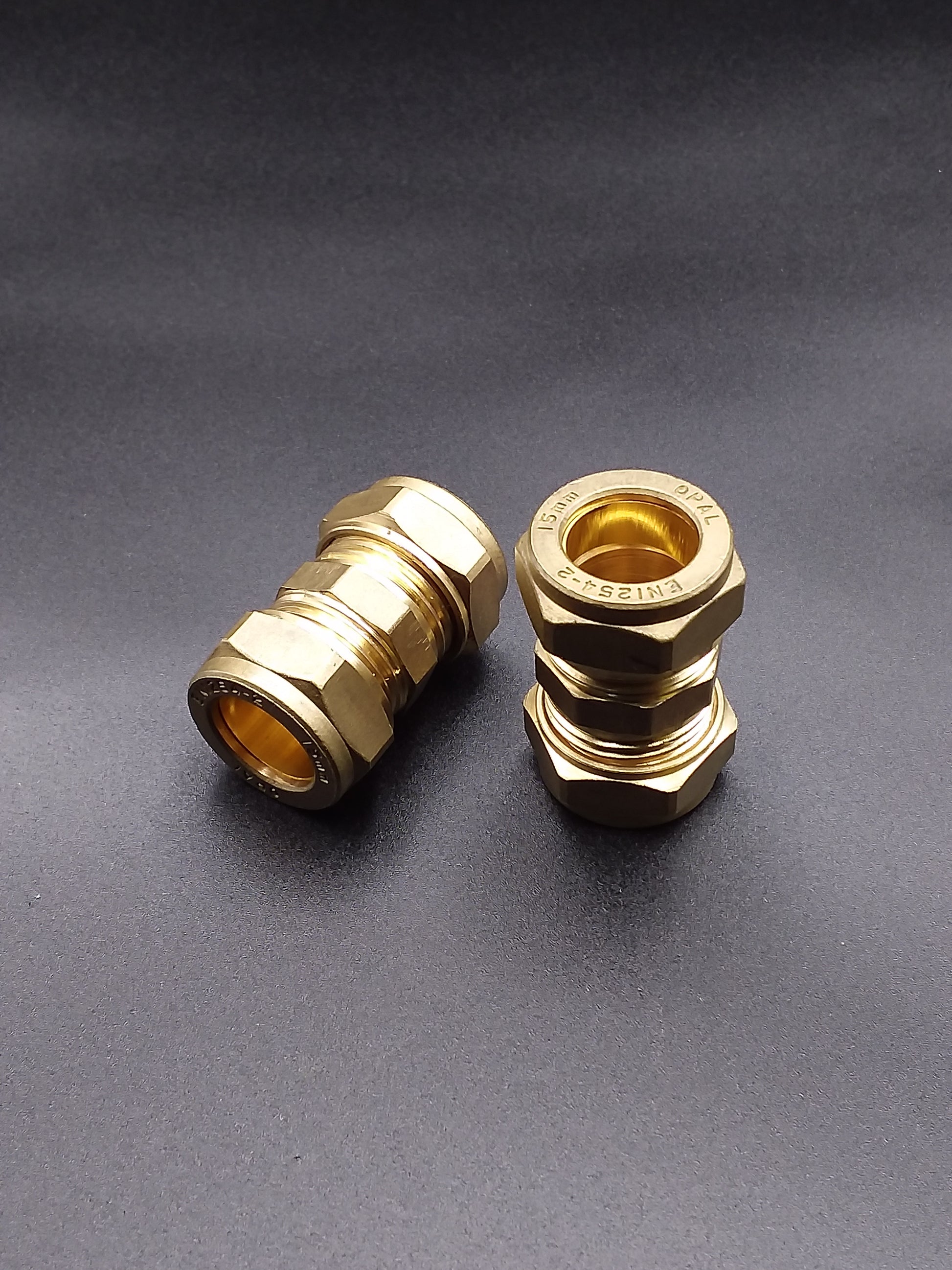 Brass compression pipe connectors.