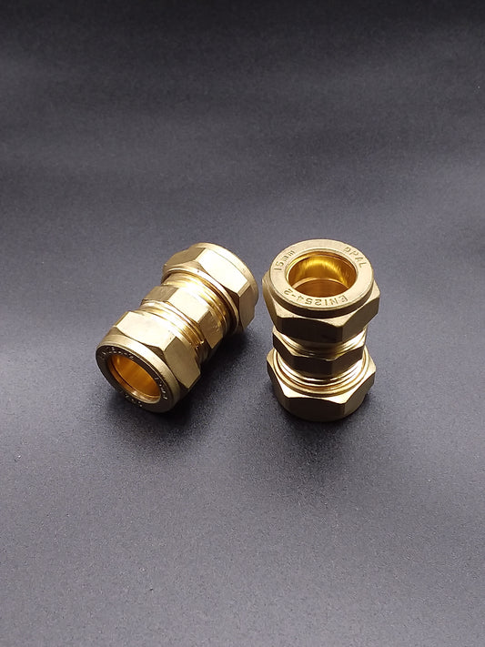 Brass compression pipe connectors.