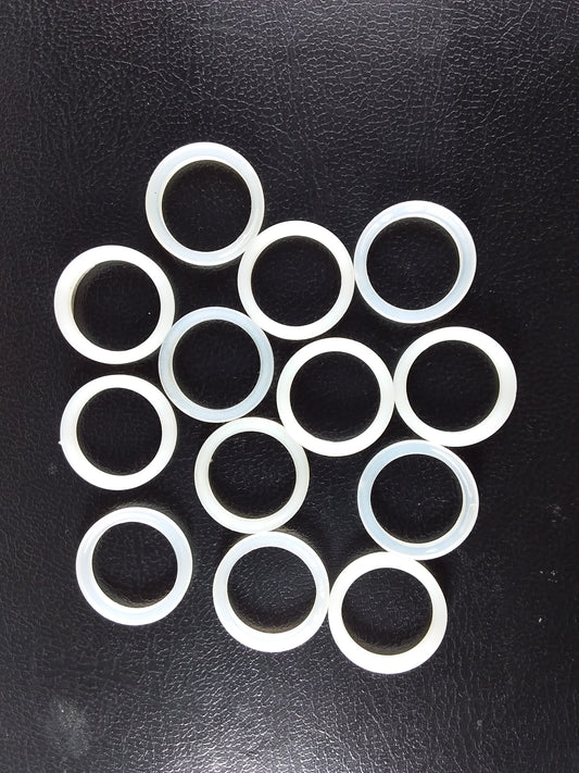 A collection of white nylon cap lining washers.