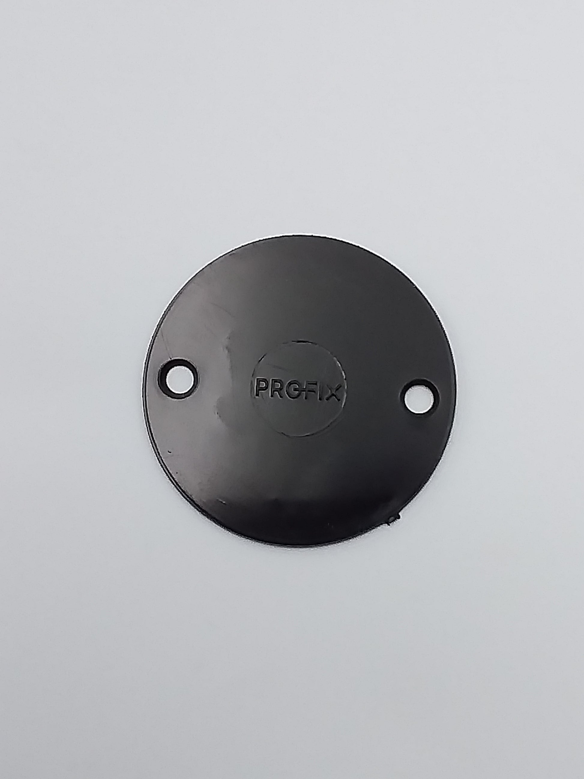 A black metal conduit box lid with the brand name 'PROFI' embossed on it.