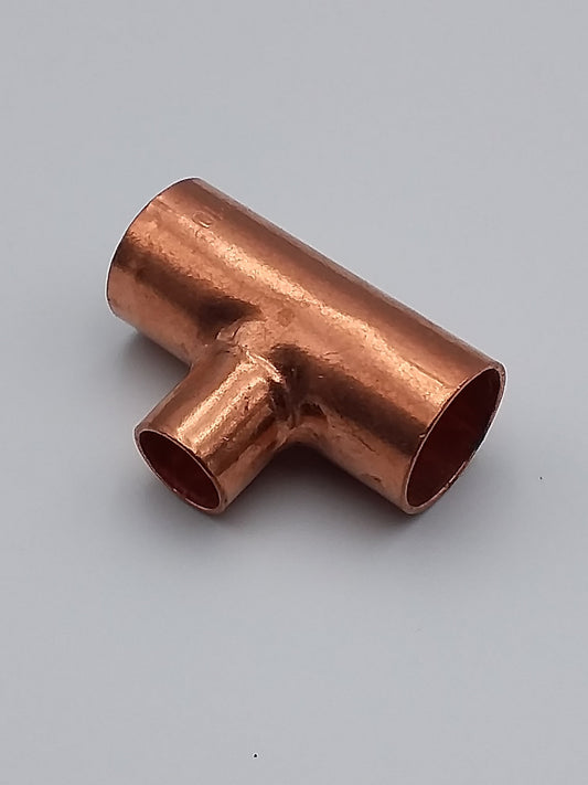 A bronze colored brass end feed reducing tee plumbing fitting.