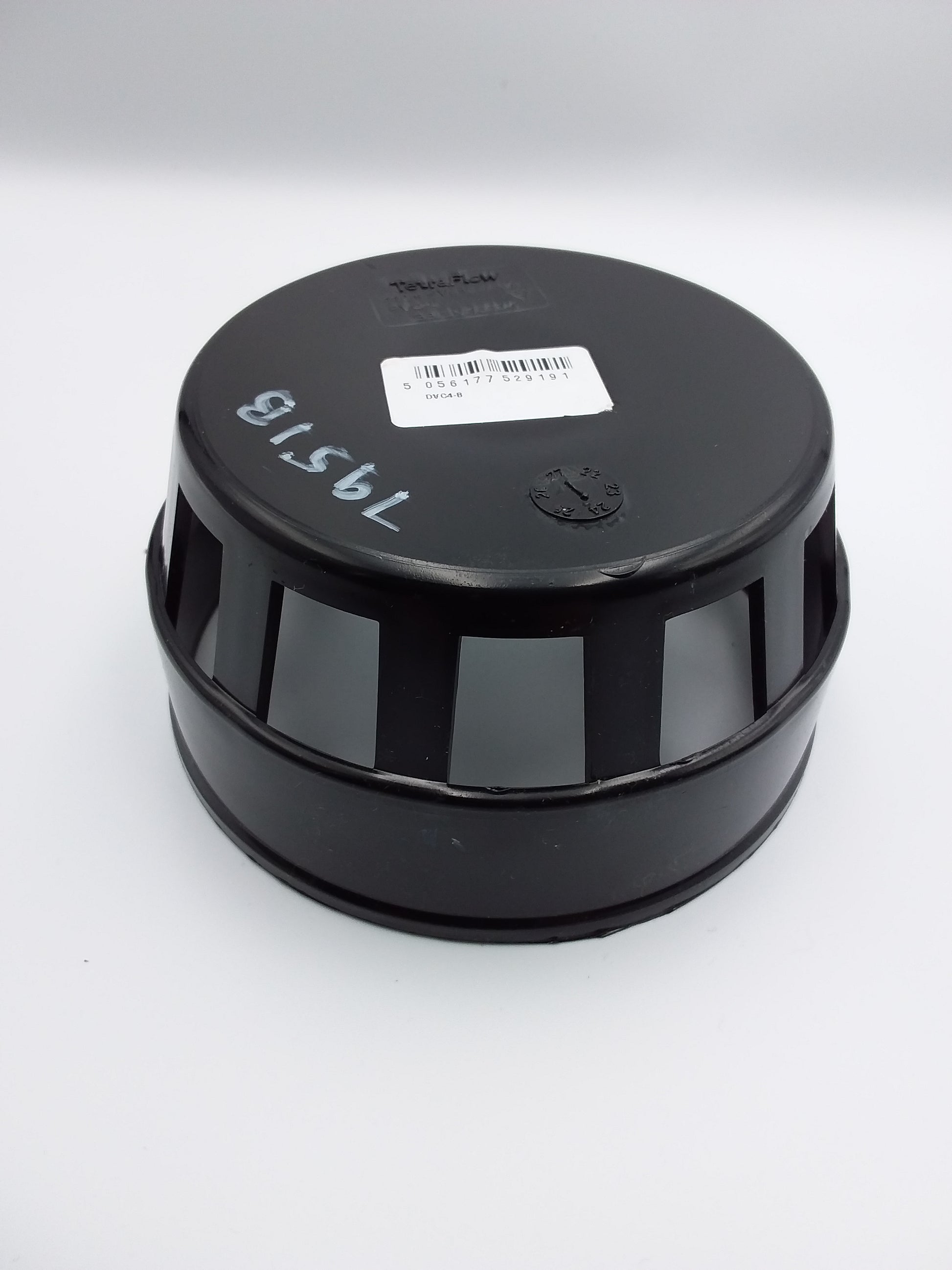 A black plastic bird cage with a label on top that reads '110 mm