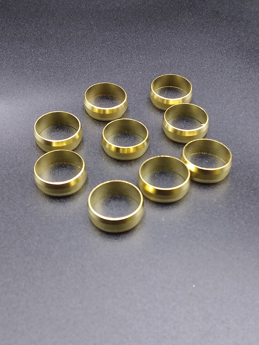 Brass olive spacers, circular in shape, displayed on a flat surface.