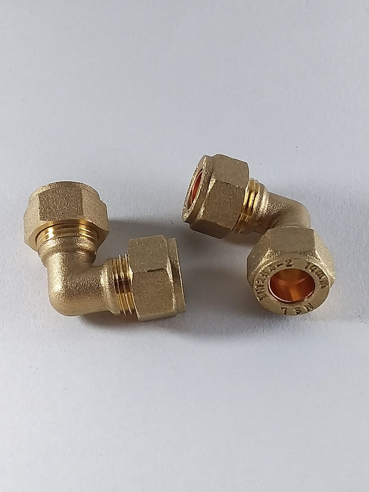 Brass compression elbow fitting.