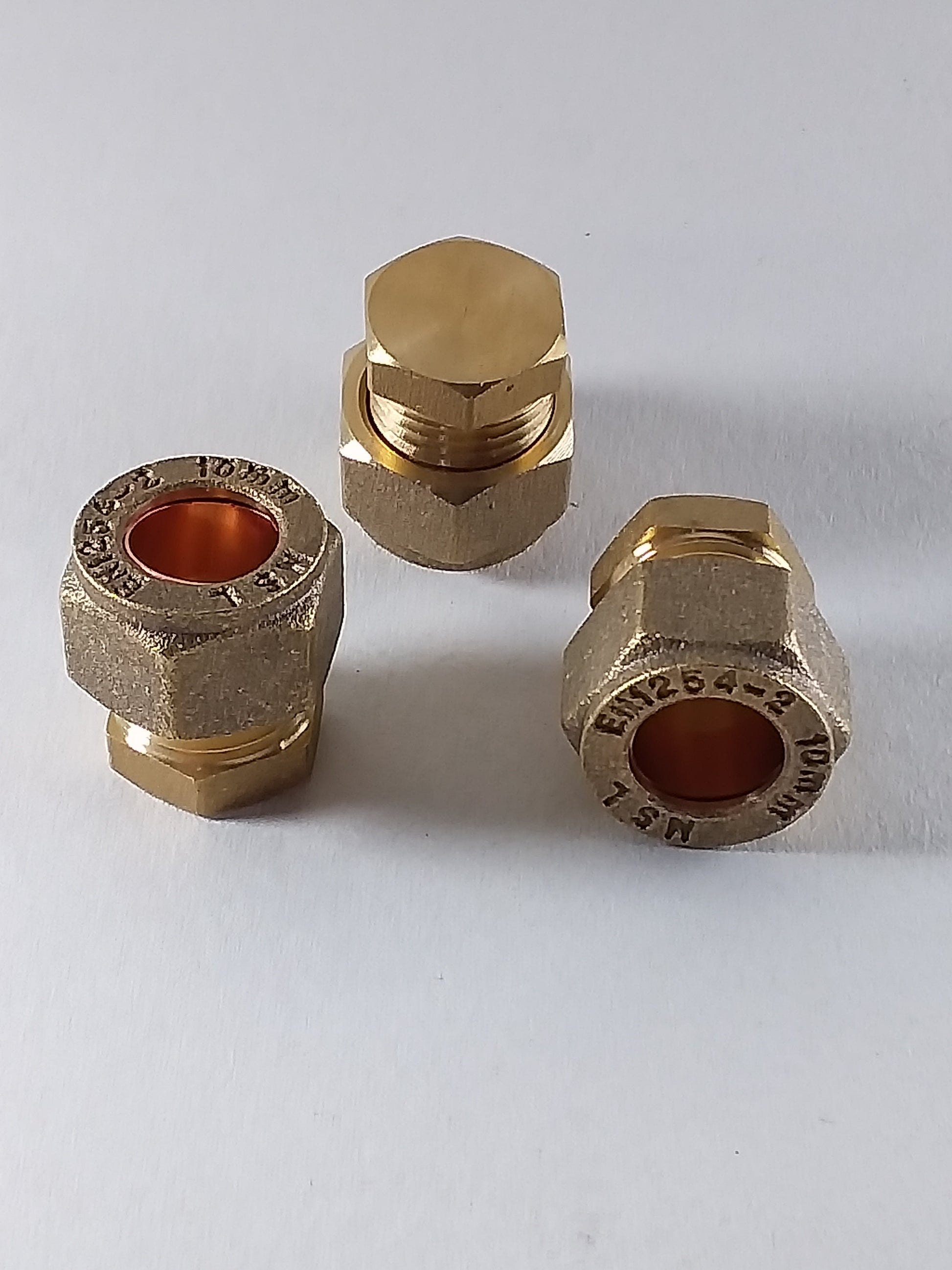 Brass plumbing caps off