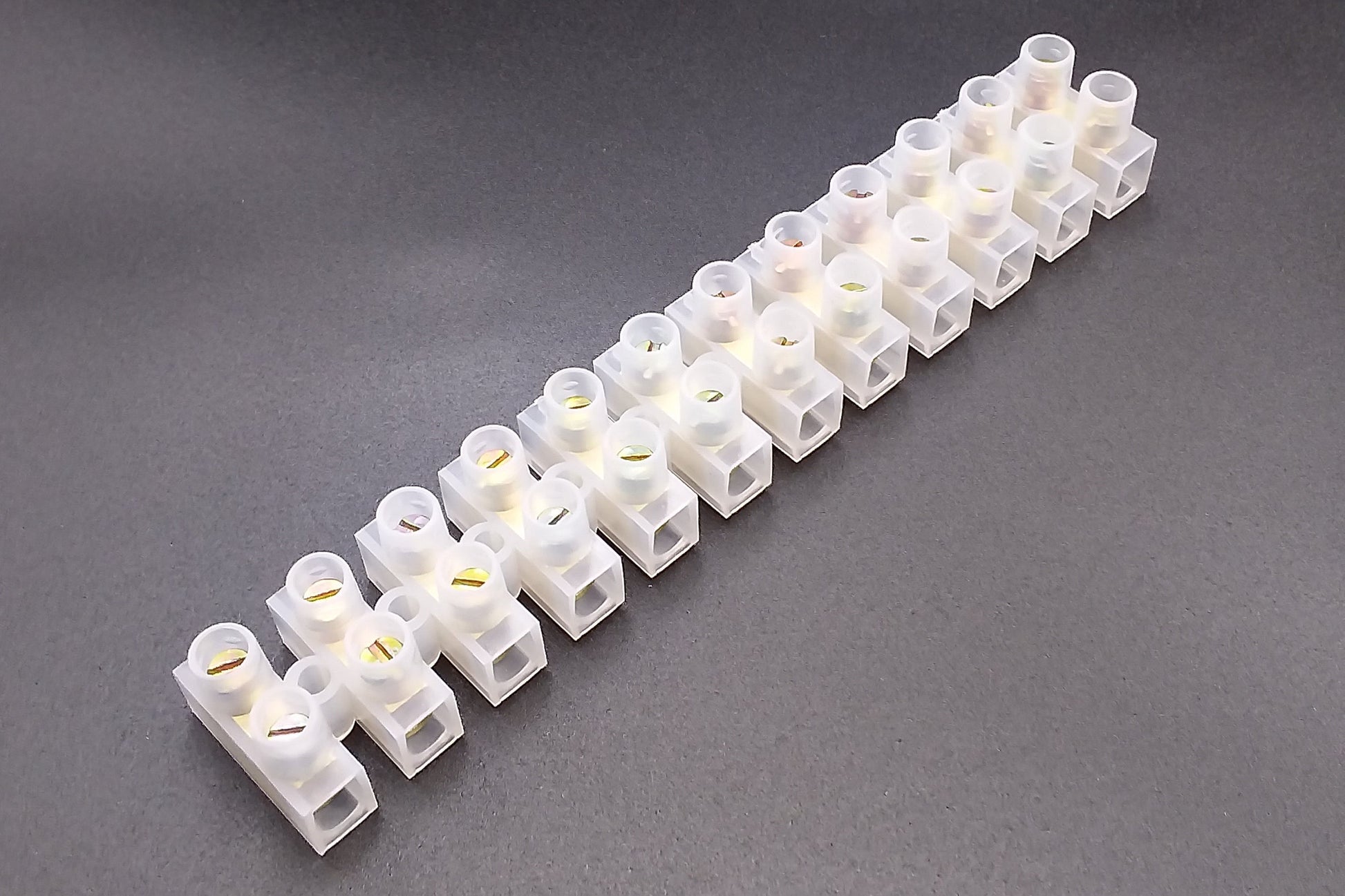 A strip of white, transparent, 60Amp electrical connectors.