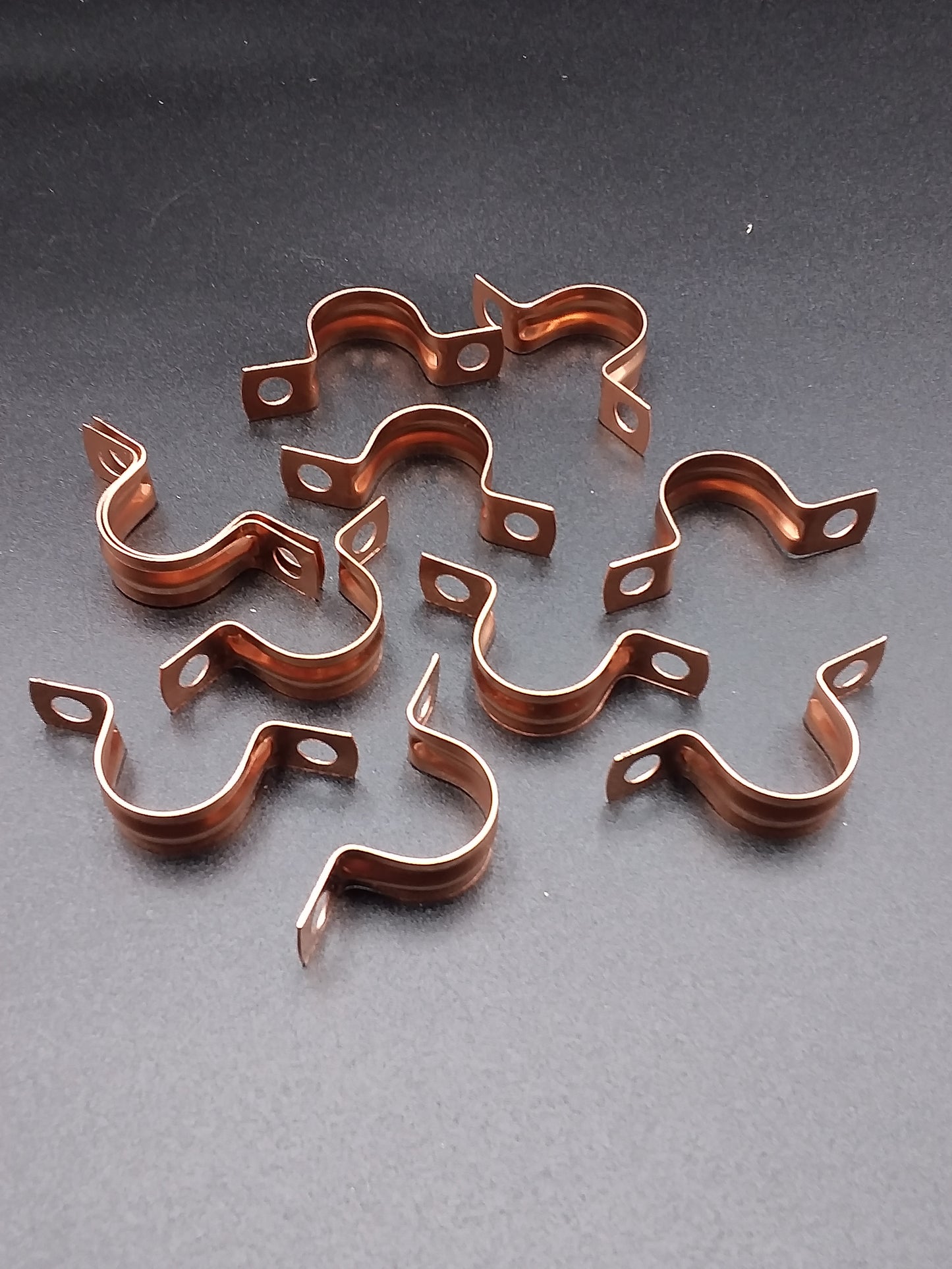15mm copper saddle clips.