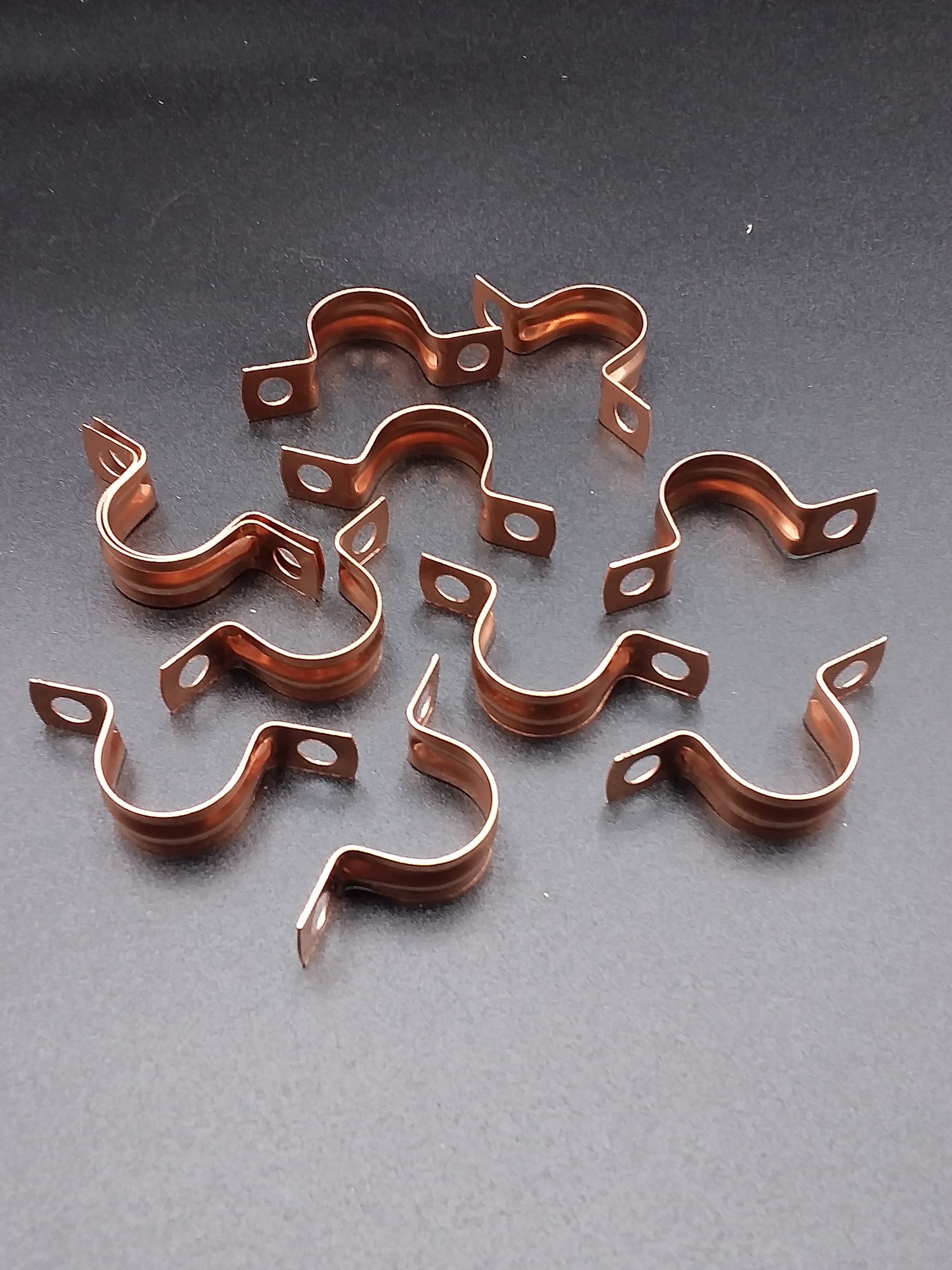 15mm copper saddle clips.