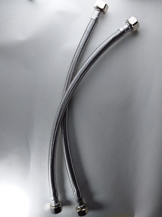 1/2" x 1/2" flexible hoses with metallic finish and connectors at both ends.