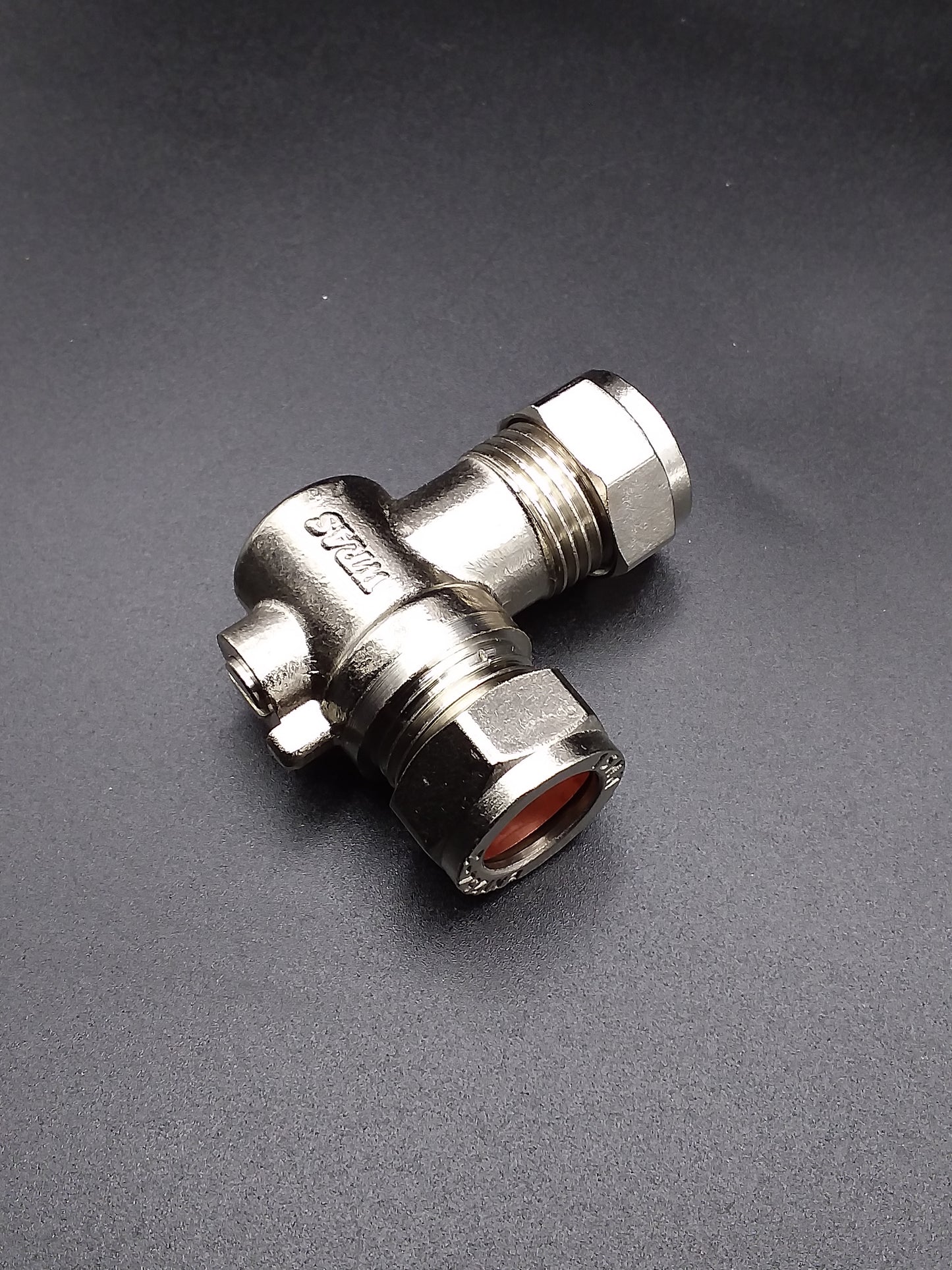 A silver-colored 15mm elbow isolating valve with threaded connections and a hand wheel for turning the valve on and off.