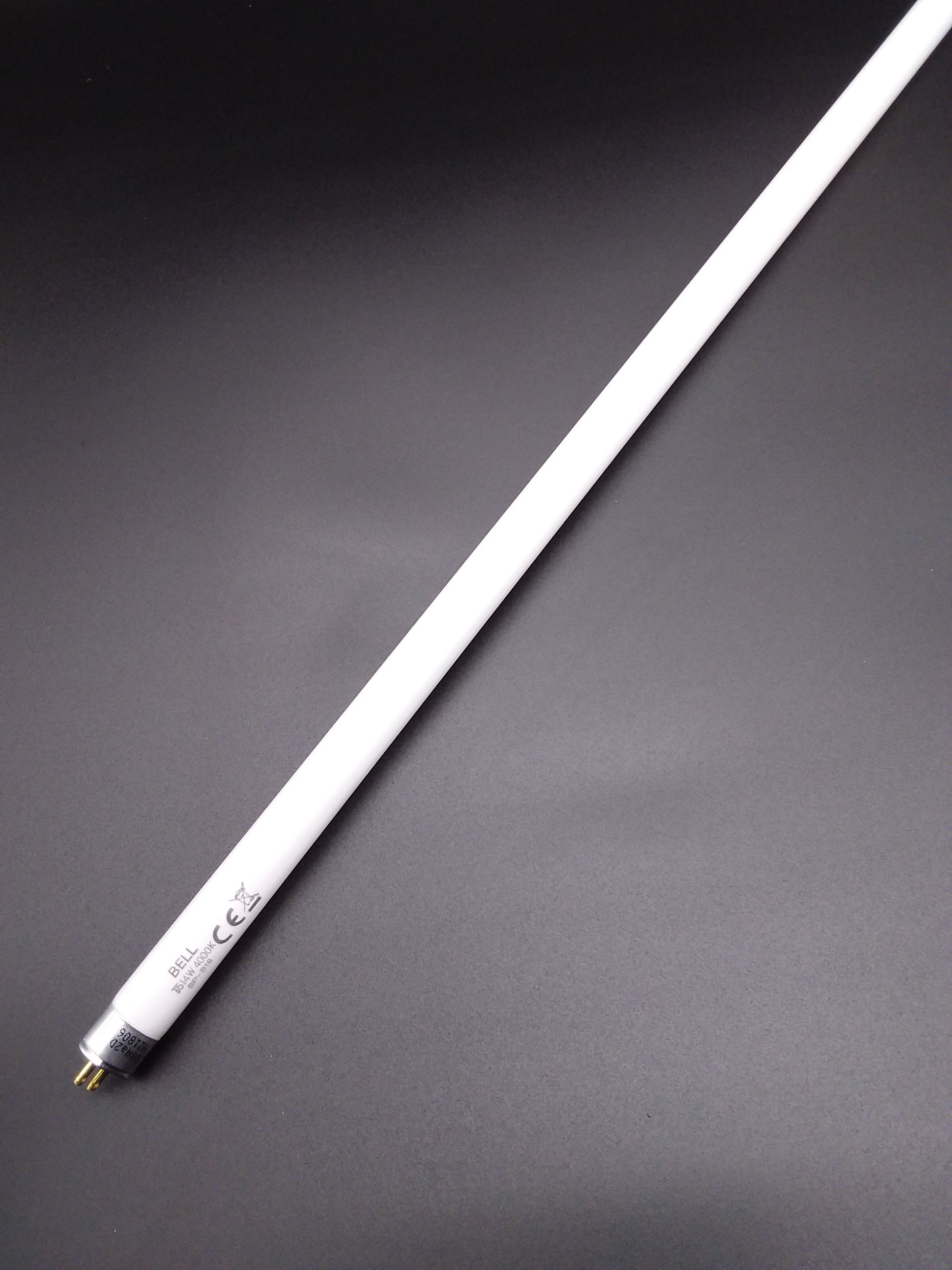 A single cool white 8W/T5 tube light against a black background.