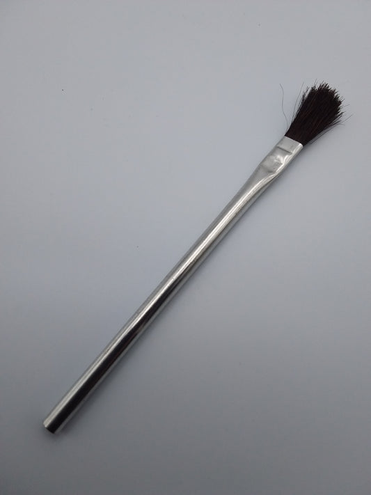 12mm flux brush with a metal handle and black bristles.