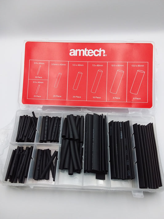 A collection of black heat shrink cable sleeving in various sizes, displayed in a clear plastic package with a red label that has the text 'Amptech' and a list of the items included in the set.
