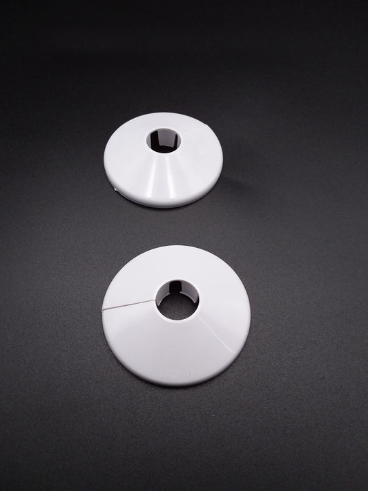 White pipe collars used for plumbing pipe.