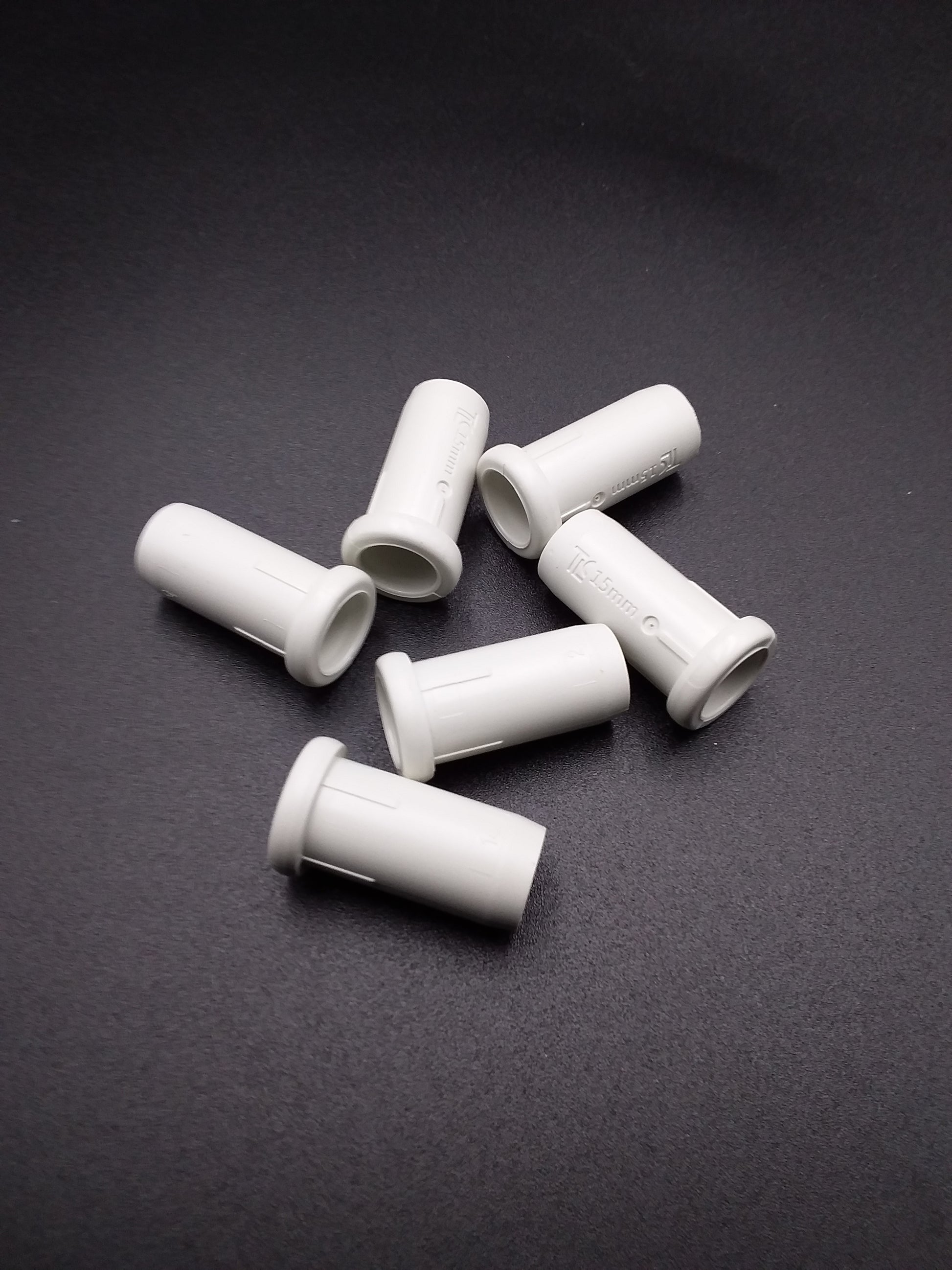 
white 22mm plastic inserts for push fit fittings.
