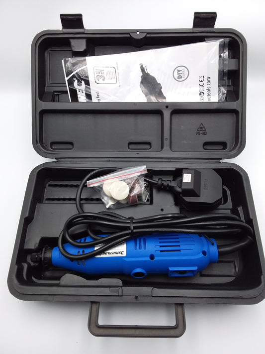 A blue rotary tool inside an open black carrying case, with power cord and multiple attachments.
