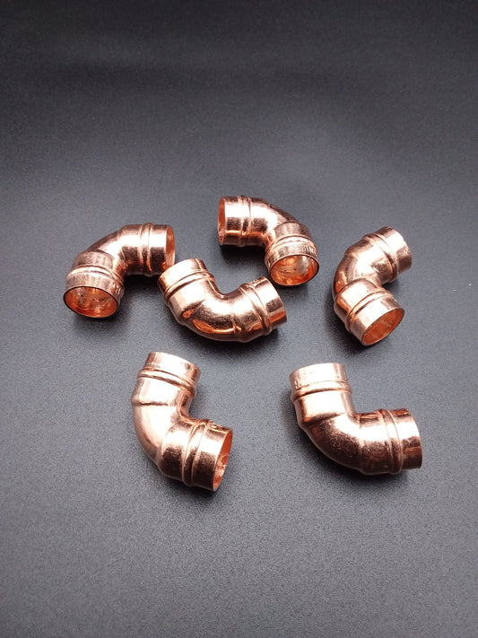 Copper solder ring elbows.