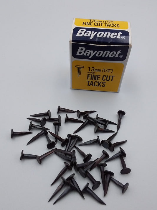 A box of 13mm steel tacks 75g box.