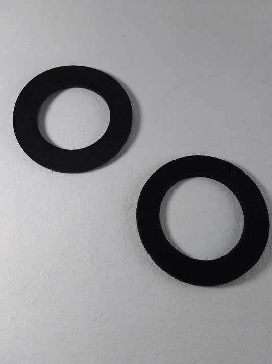 Two black rubber washers for a faucet.