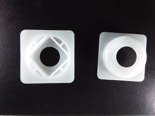 1/2" square top hat spacer washers with a central circular hole.